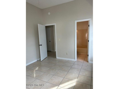 Charming cottage with 11 foot ceilings, bright and airy with a on Pearl Golf Links in North Carolina - for sale on GolfHomes.com, golf home, golf lot