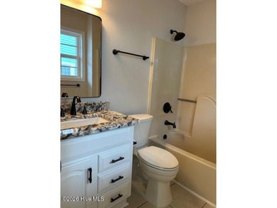 Charming cottage with 11 foot ceilings, bright and airy with a on Pearl Golf Links in North Carolina - for sale on GolfHomes.com, golf home, golf lot