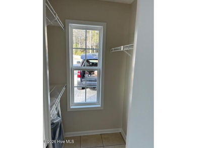 Charming cottage with 11 foot ceilings, bright and airy with a on Pearl Golf Links in North Carolina - for sale on GolfHomes.com, golf home, golf lot