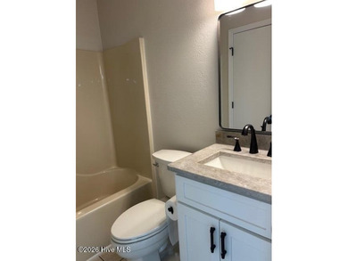 Charming cottage with 11 foot ceilings, bright and airy with a on Pearl Golf Links in North Carolina - for sale on GolfHomes.com, golf home, golf lot