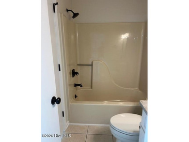 Charming cottage with 11 foot ceilings, bright and airy with a on Pearl Golf Links in North Carolina - for sale on GolfHomes.com, golf home, golf lot