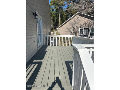 Charming cottage with 11 foot ceilings, bright and airy with a on Pearl Golf Links in North Carolina - for sale on GolfHomes.com, golf home, golf lot