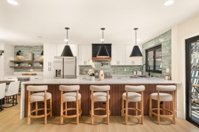 Live lakeside luxury every day in this breathtakingly remodeled on Lake San Marcos Country Club- South Course in California - for sale on GolfHomes.com, golf home, golf lot