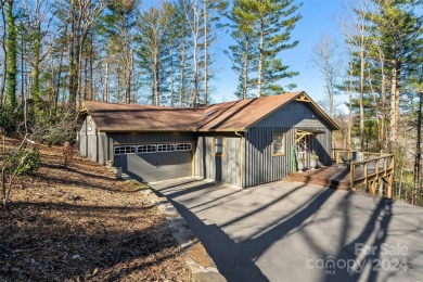 Perched above Hickory Hills Golf Course, this 3-bedroom, 4-bath on Grassy Creek Golf and Country Club in North Carolina - for sale on GolfHomes.com, golf home, golf lot