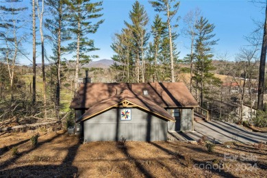 Perched above Hickory Hills Golf Course, this 3-bedroom, 4-bath on Grassy Creek Golf and Country Club in North Carolina - for sale on GolfHomes.com, golf home, golf lot