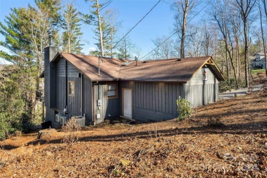 Perched above Hickory Hills Golf Course, this 3-bedroom, 4-bath on Grassy Creek Golf and Country Club in North Carolina - for sale on GolfHomes.com, golf home, golf lot