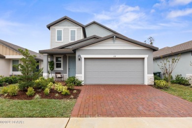 Welcome to 118 Pitching Wedge Drive, a stunning 2023-built home on LPGA International Golf Course in Florida - for sale on GolfHomes.com, golf home, golf lot