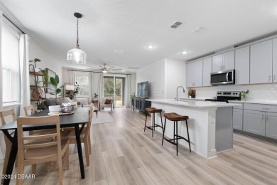 Welcome to 118 Pitching Wedge Drive, a stunning 2023-built home on LPGA International Golf Course in Florida - for sale on GolfHomes.com, golf home, golf lot