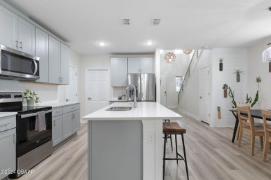 Welcome to 118 Pitching Wedge Drive, a stunning 2023-built home on LPGA International Golf Course in Florida - for sale on GolfHomes.com, golf home, golf lot
