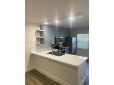A must see recently renovated corner unit townhouse at Stamford on Bear Lakes Country Club in Florida - for sale on GolfHomes.com, golf home, golf lot