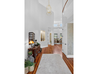 Beautiful brick custom home with FIRST FLOOR PRIMARY SUITE on Dunes West Golf Club in South Carolina - for sale on GolfHomes.com, golf home, golf lot