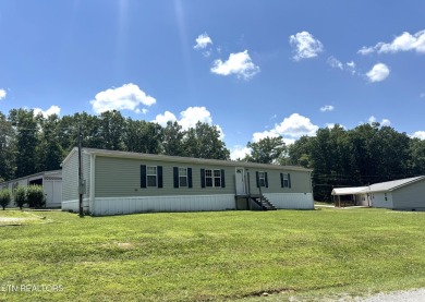 Welcome to your new home! This corner lot manufactured home in on Lake Tansi Village Country Club in Tennessee - for sale on GolfHomes.com, golf home, golf lot