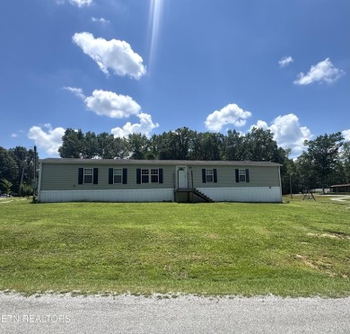 Welcome to your new home! This corner lot manufactured home in on Lake Tansi Village Country Club in Tennessee - for sale on GolfHomes.com, golf home, golf lot