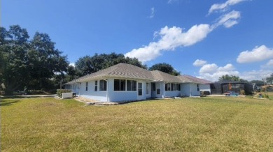 This charming home at 321 Duane Palmer Blvd in Sebring, FL has a on Spring Lake Golf Resort in Florida - for sale on GolfHomes.com, golf home, golf lot