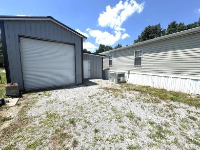 Welcome to your new home! This corner lot manufactured home in on Lake Tansi Village Country Club in Tennessee - for sale on GolfHomes.com, golf home, golf lot