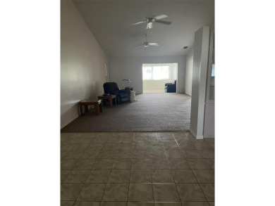 This charming home at 321 Duane Palmer Blvd in Sebring, FL has a on Spring Lake Golf Resort in Florida - for sale on GolfHomes.com, golf home, golf lot