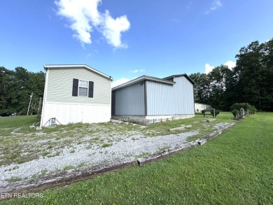 Welcome to your new home! This corner lot manufactured home in on Lake Tansi Village Country Club in Tennessee - for sale on GolfHomes.com, golf home, golf lot