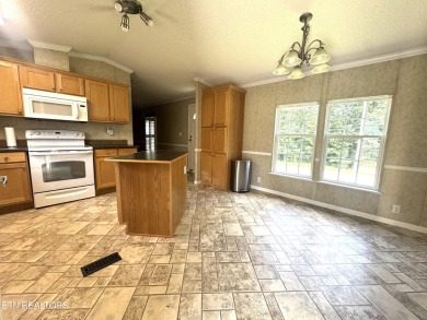 Welcome to your new home! This corner lot manufactured home in on Lake Tansi Village Country Club in Tennessee - for sale on GolfHomes.com, golf home, golf lot