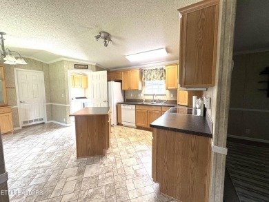 Welcome to your new home! This corner lot manufactured home in on Lake Tansi Village Country Club in Tennessee - for sale on GolfHomes.com, golf home, golf lot