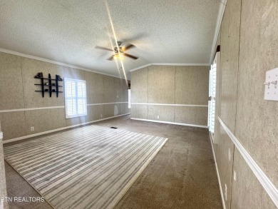 Welcome to your new home! This corner lot manufactured home in on Lake Tansi Village Country Club in Tennessee - for sale on GolfHomes.com, golf home, golf lot