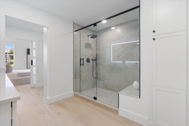 Discover a refined take on modern living in this fully renovated on Polo Club of Boca Raton in Florida - for sale on GolfHomes.com, golf home, golf lot