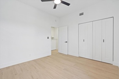 Discover a refined take on modern living in this fully renovated on Polo Club of Boca Raton in Florida - for sale on GolfHomes.com, golf home, golf lot