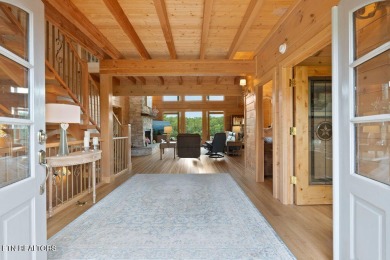 This Luxury Upscale Custom Lakefront Log  Stone Home invites you on Tellico Village -The Links At Kahite Golf Course in Tennessee - for sale on GolfHomes.com, golf home, golf lot