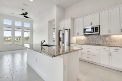 MOVE-IN READY WATERFRONT 4BR/3BA home in sought-after on LPGA International Golf Course in Florida - for sale on GolfHomes.com, golf home, golf lot
