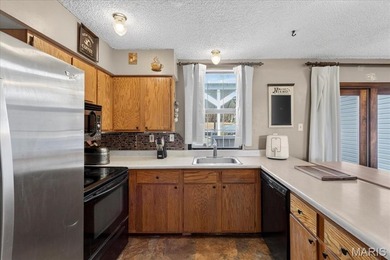 Welcome to Raintree Village Condominiums!  This 2-bedroom, 1 on Raintree Country Club in Missouri - for sale on GolfHomes.com, golf home, golf lot