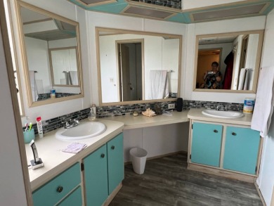 This lovely, manufactured home on leased land is located in Lake on Lake Fairways Country Club in Florida - for sale on GolfHomes.com, golf home, golf lot