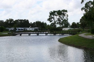 This lovely, manufactured home on leased land is located in Lake on Lake Fairways Country Club in Florida - for sale on GolfHomes.com, golf home, golf lot