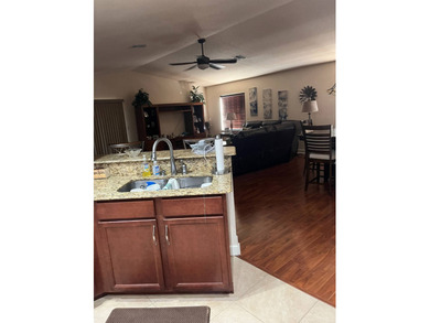 Foyer entry into the open living area with cathedral ceilings. A on Spanish Lakes Fairways in Florida - for sale on GolfHomes.com, golf home, golf lot