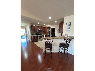 Foyer entry into the open living area with cathedral ceilings. A on Spanish Lakes Fairways in Florida - for sale on GolfHomes.com, golf home, golf lot
