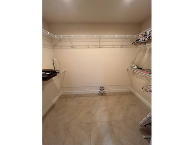 Foyer entry into the open living area with cathedral ceilings. A on Spanish Lakes Fairways in Florida - for sale on GolfHomes.com, golf home, golf lot