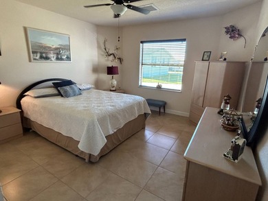 Foyer entry into the open living area with cathedral ceilings. A on Spanish Lakes Fairways in Florida - for sale on GolfHomes.com, golf home, golf lot
