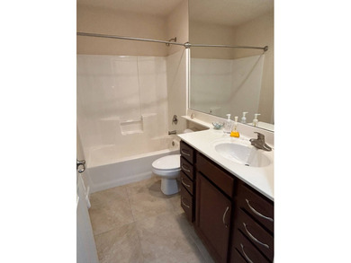 Foyer entry into the open living area with cathedral ceilings. A on Spanish Lakes Fairways in Florida - for sale on GolfHomes.com, golf home, golf lot