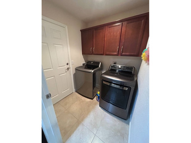 Foyer entry into the open living area with cathedral ceilings. A on Spanish Lakes Fairways in Florida - for sale on GolfHomes.com, golf home, golf lot