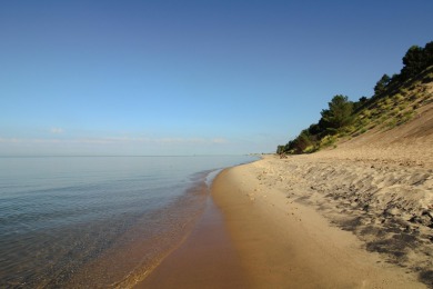 Embark on an extraordinary lifestyle at Lakeside Dunes on Muskegon Country Club in Michigan - for sale on GolfHomes.com, golf home, golf lot