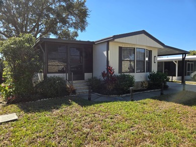 This 2BR/2BA, 896 sq. ft. home is beautifully updated and on Lake Henry Golf Club in Florida - for sale on GolfHomes.com, golf home, golf lot