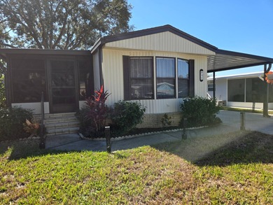 This 2BR/2BA, 896 sq. ft. home is beautifully updated and on Lake Henry Golf Club in Florida - for sale on GolfHomes.com, golf home, golf lot