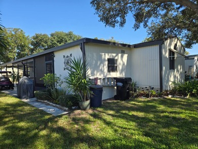 This 2BR/2BA, 896 sq. ft. home is beautifully updated and on Lake Henry Golf Club in Florida - for sale on GolfHomes.com, golf home, golf lot