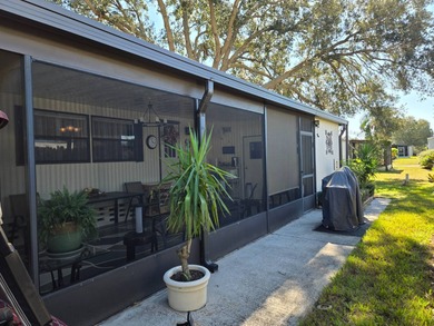 This 2BR/2BA, 896 sq. ft. home is beautifully updated and on Lake Henry Golf Club in Florida - for sale on GolfHomes.com, golf home, golf lot