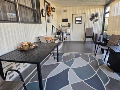 This 2BR/2BA, 896 sq. ft. home is beautifully updated and on Lake Henry Golf Club in Florida - for sale on GolfHomes.com, golf home, golf lot