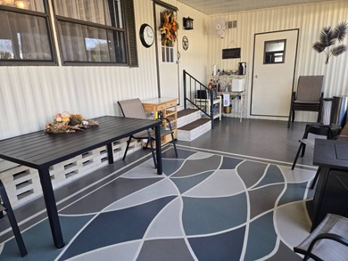 This 2BR/2BA, 896 sq. ft. home is beautifully updated and on Lake Henry Golf Club in Florida - for sale on GolfHomes.com, golf home, golf lot