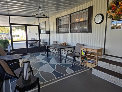 This 2BR/2BA, 896 sq. ft. home is beautifully updated and on Lake Henry Golf Club in Florida - for sale on GolfHomes.com, golf home, golf lot