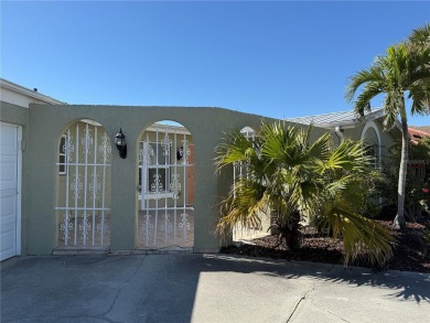 Spanish style WATERFRONT home located in desirable deed on Saint Andrews South Golf Club in Florida - for sale on GolfHomes.com, golf home, golf lot