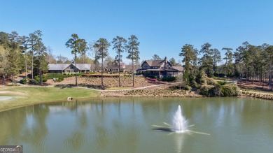 Experience elevated living in Reynolds Lake Oconee with this on Reynolds Lake Oconee - The National  in Georgia - for sale on GolfHomes.com, golf home, golf lot