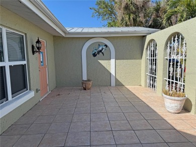 Spanish style WATERFRONT home located in desirable deed on Saint Andrews South Golf Club in Florida - for sale on GolfHomes.com, golf home, golf lot