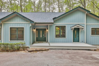 Nestled in the popular Holly Forest community of Sapphire, this on Sapphire National Golf Club in North Carolina - for sale on GolfHomes.com, golf home, golf lot