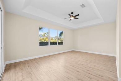 Reimagined and move-in ready, this waterfront home on an on The Legacy Golf and Tennis Club in Florida - for sale on GolfHomes.com, golf home, golf lot